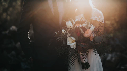Wedding rings and couple hands during ceremony coverage